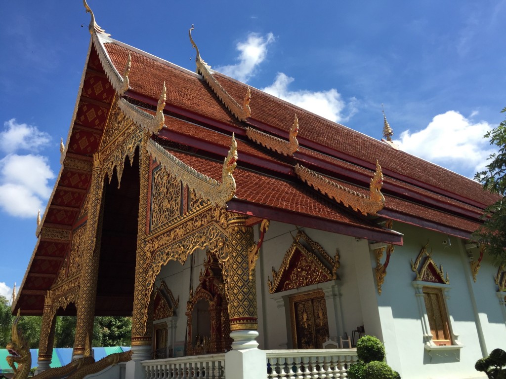 One thing that keeps striking me as odd about Thai temples is that parts are ornate, and other parts aren't. Like, OMG the gold detail on the front wall. Or on the window caps, or the corners of the roof. And then they come to the wall and go, "Meh, white spackle should do it." It's a different aesthetic taste than you see in the west -- if we had that level of detail on the front of a temple, we'd keep it up all the way around. It would be gaudy, but by gods we'd do it.