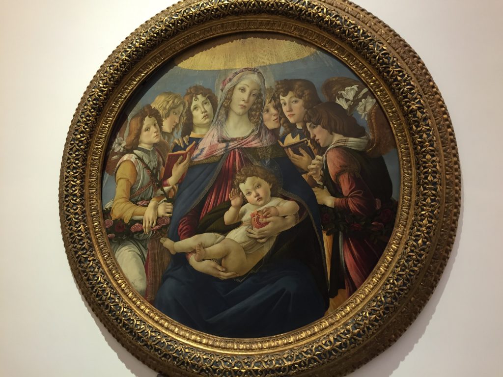Botticelli's Madonna of the Pomegranate. Even a famous painter like Botticelli couldn't make Madonna or Child look like they give a damn. Mom looks mind-numbingly indifferent, Child has the look a cat gets when it's about to squirm out of your lap, and even the One Direction winged boy band looks bored.